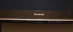 lot 43 image: Panasonic 65 Inch Wall Mount TV with Remote