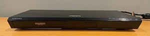 lot 124 image: Samsung Ultra HD Blu-ray DVD player with Remote