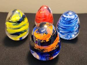 lot 126 image: Colorful Collection of Egg-Shaped Glass Paperweights