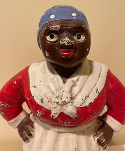 lot 8 image: Antique Aunt Jemima Cast Iron Doorstop