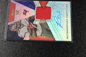 lot 29 image: 2021 XR Autographed Swatches Ronald Jones II #AUS-RJO 515  Only 15 Exist