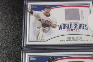 lot 69 image: 2015 Topps World Series Jersey Patch Relic Lot  Brandon Belt & Tim Hudson  Both Cards Serial Numbered to 100