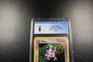 lot 126 image: 1999 Pokemon Jungle Holo Mr. Mime #664 CGC 8