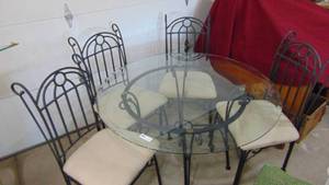 lot 1 image: 45in round glass top black metal table and chairs