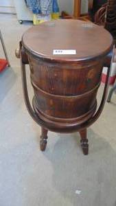 lot 7 image: Barrel style side table. opens for storage