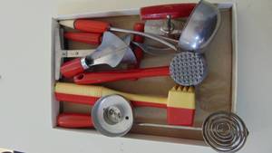 lot 24 image: Vintage red handle kitchen utensils