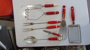 lot 25 image: Vintage red handle kitchen utensils