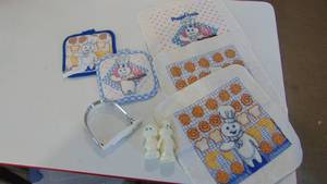 lot 59 image: Pillsbury Doughboy potholders, S&P and mixer