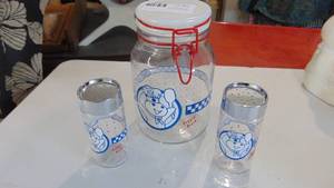 lot 60 image: Pillsbury Doughboy glass canister and shakers