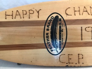 lot 63 image: Decor cano paddle made into a coat rack that states gone fishing
