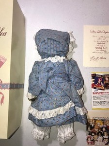 lot 302 image: Collectors doll with cat face in original box