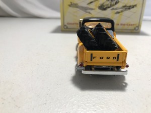 lot 322 image: 1997 Matchbox Caterpillar branded 1955 Ford Pick Up die cast 143 scale
