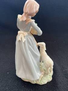 lot 41 image: Porcelain Figure of Woman with Produce Basket and Lamb