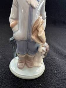 lot 58 image: Lladro Boy with Dog Figurine