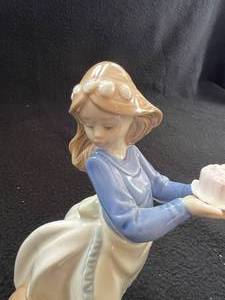 lot 62 image: Lladro Nao Girl Holding Cake from Dog Figurine