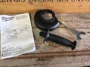 lot 77 image: Milwaukee M18 4 12 Grinder Accessories