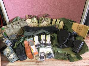 lot 131 image: MilitaryTatical Holsters - Mag Pouches - Trigger Locks - Gear