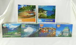 lot 104 image: Lot of 2 Vintage Assorted According to Hoyle 550 Piece Sealed Puzzles and 12 Vintage According to Hoyle Canadian Design Series 1000 Piece Sealed Puzzles