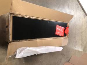 lot 28 image: Home Decorators Collection  Bradstone 4 Door Charcoal Black Storage Console Customer returns See Pics