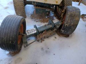lot 62 image: Bolens Front Axle with Two Flat Tires and Rims