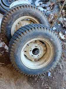 lot 64 image: Bolens Transmission, Rear Axle, and a Pair of 26 X 8.5 Rear Tires and Rims