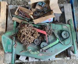 lot 140 image: Bolens 40-inch Mower Deck - Green with Tire Chains and Assorted Parts