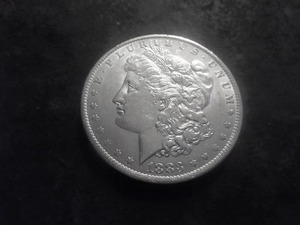 lot 21 image: 1883 O Morgan Silver Dollar