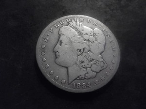 lot 24 image: 1884 CC Morgan Silver Dollar