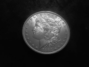 lot 25 image: 1884 O Morgan Silver Dollar