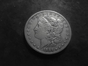 lot 26 image: 1884 S Morgan Silver Dollar
