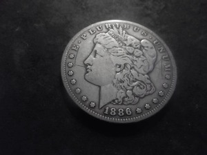 lot 32 image: 1886 S Morgan Silver Dollar