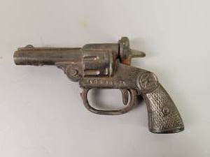 lot 32 image: Antique Cast Iron Toy Gun - Marked N and Made in the USA