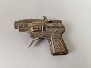 lot 39 image: 1950s Pressed Tin Toy Gun Automatic Gun Swallow