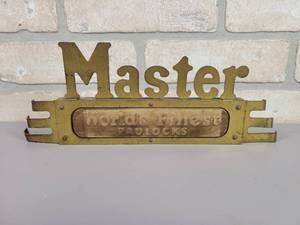 lot 58 image: Antique Master Locks Brass Display Badge Worlds Finest Locks
