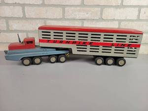 lot 97 image: Vintage SSS International Tin Litho Turnpike Line Semi Truck and Trailer Toy