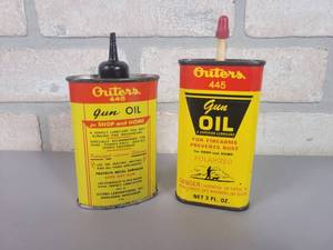 lot 102 image: (2) Vintage Outers GUN OIL Cans