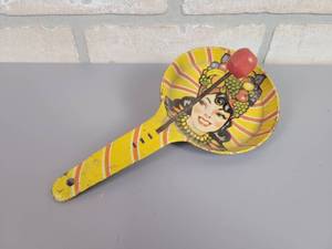 lot 154 image: Vintage Tin Litho Carmen Miranda The Brazilian Bombshell Noise Maker