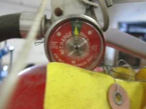 3 fire extinguishers 1 has a charge...