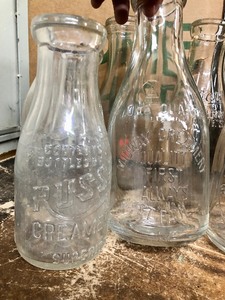 lot 250 image: Collection of Vintage Embossed Dairy Bottles