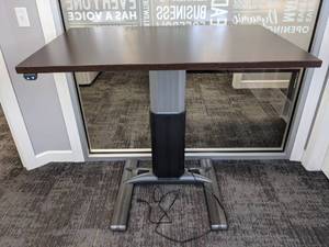 lot 127 image: Workrite Wood Colored Electric Adjustable Table