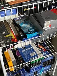 lot 132 image: White Rolling Cart with Video Cassettes