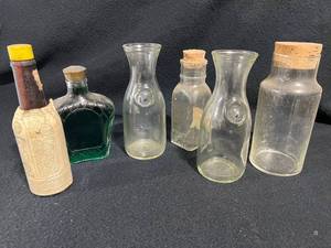 lot 35 image: Vintage Bottles with Corks, Litre Bottles, and More