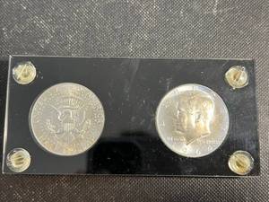 2 X 1964 SILVER KENNEDY HALF DOLLARS IN BLACK PLASTIC