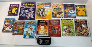 lot 93 image: Group Of Vintage Pokemon Books And Nintendo DS Pokemon Black Version Carring Case 2011