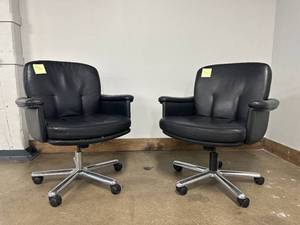 lot 56 image: Pair of black leather office armchairs