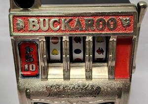 lot 114 image: Vintage Buckaroo Slot Machine Bank