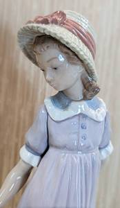 lot 54 image: Lladro Pulling the Doll Carriage Porcelain Figurine- 5044