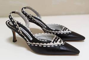 lot 212 image: Manolo Blahnik Black and White Leather Slingbacks