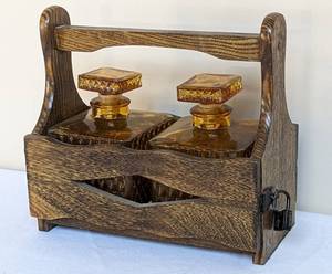 lot 245 image: Vintage Two Bottle Locking Amber Glass Decanter Set