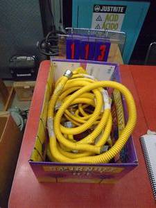 Box of 10 appliance gas lines. Some with brass fittings. As shown.